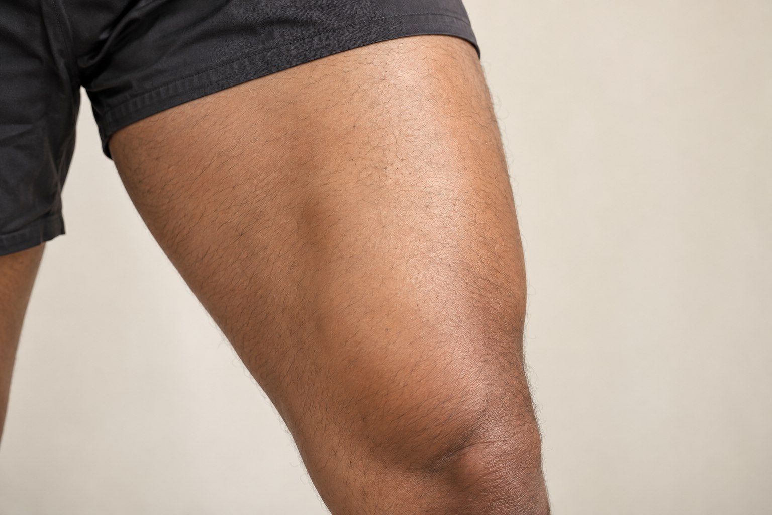 Thigh and Leg placement reference, male adult AI model, no tattoo applied