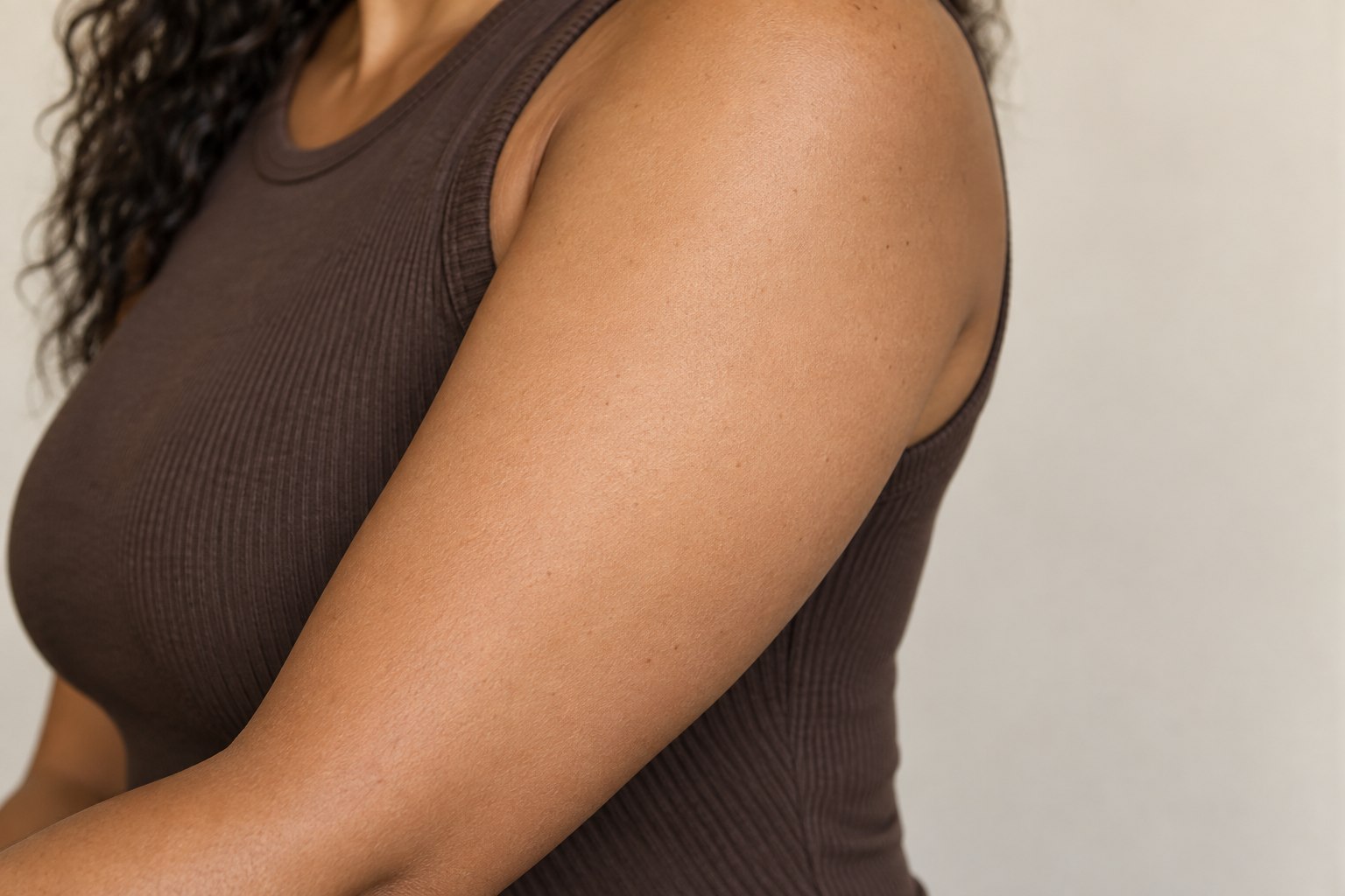 Upper Arm placement reference, female adult AI model, no tattoo applied